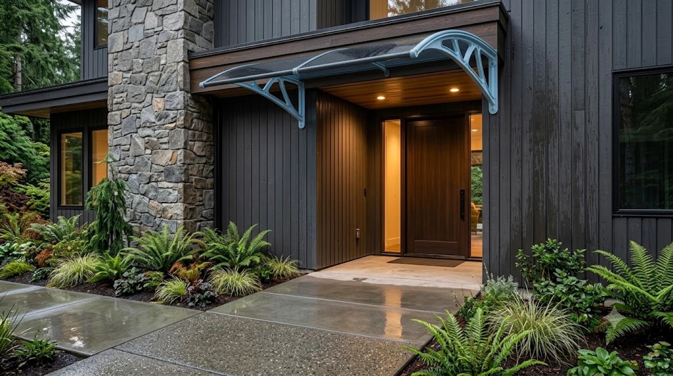 Completed custom awning installed over a modern home entrance